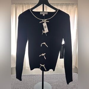 Madden Girl Black Long-Sleeve Ribbed Top with Cream Bow Trim